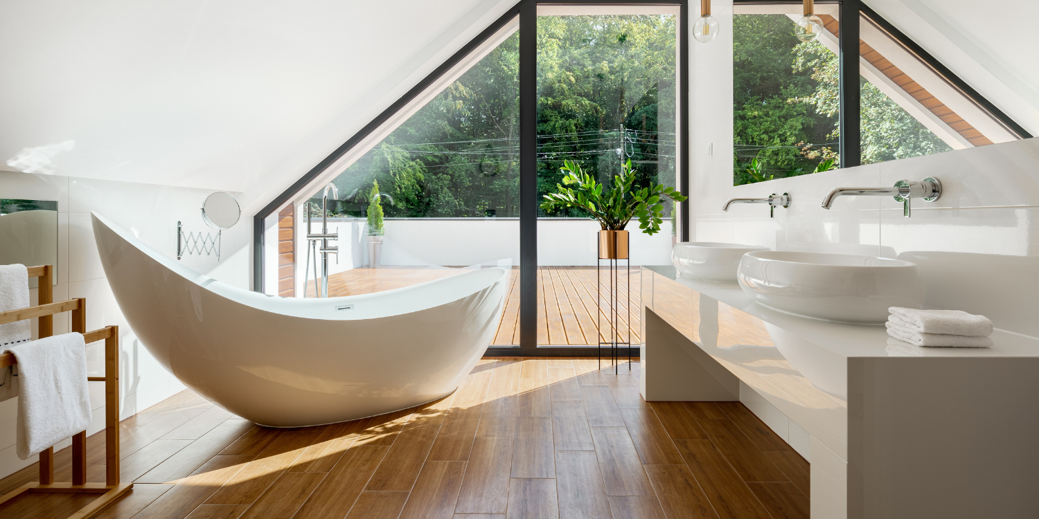 Modern Luxury Bathroom With Earth Tones And Stand Alone Tub - What Are the Essential Steps for Planning a Luxury Home Renovation?